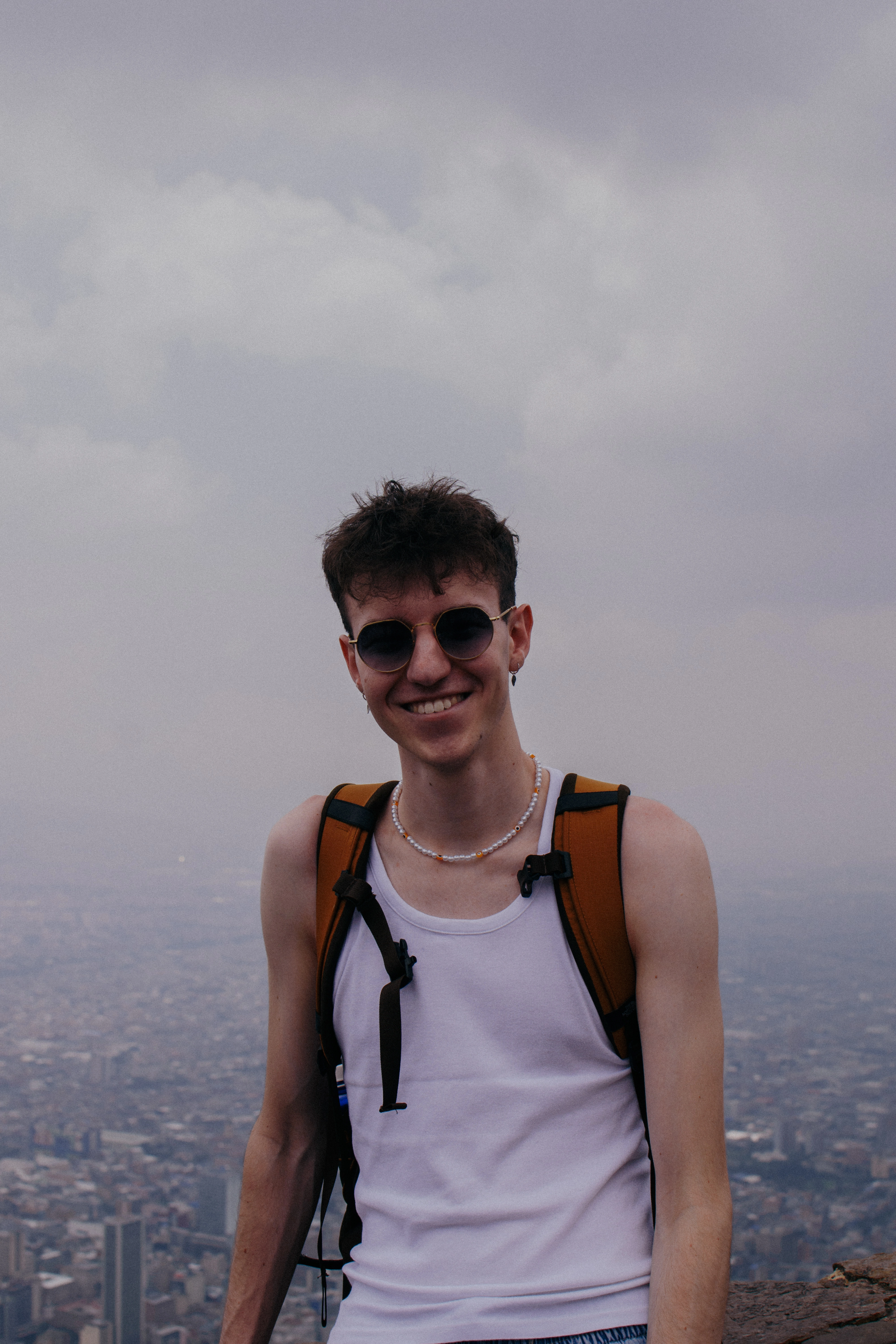 Image of Pedro Pontes García wearing sunglasses smiling with a city backdrop.